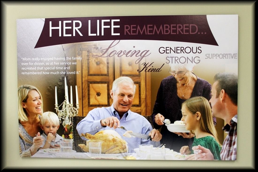 Family at table, man carving food, words