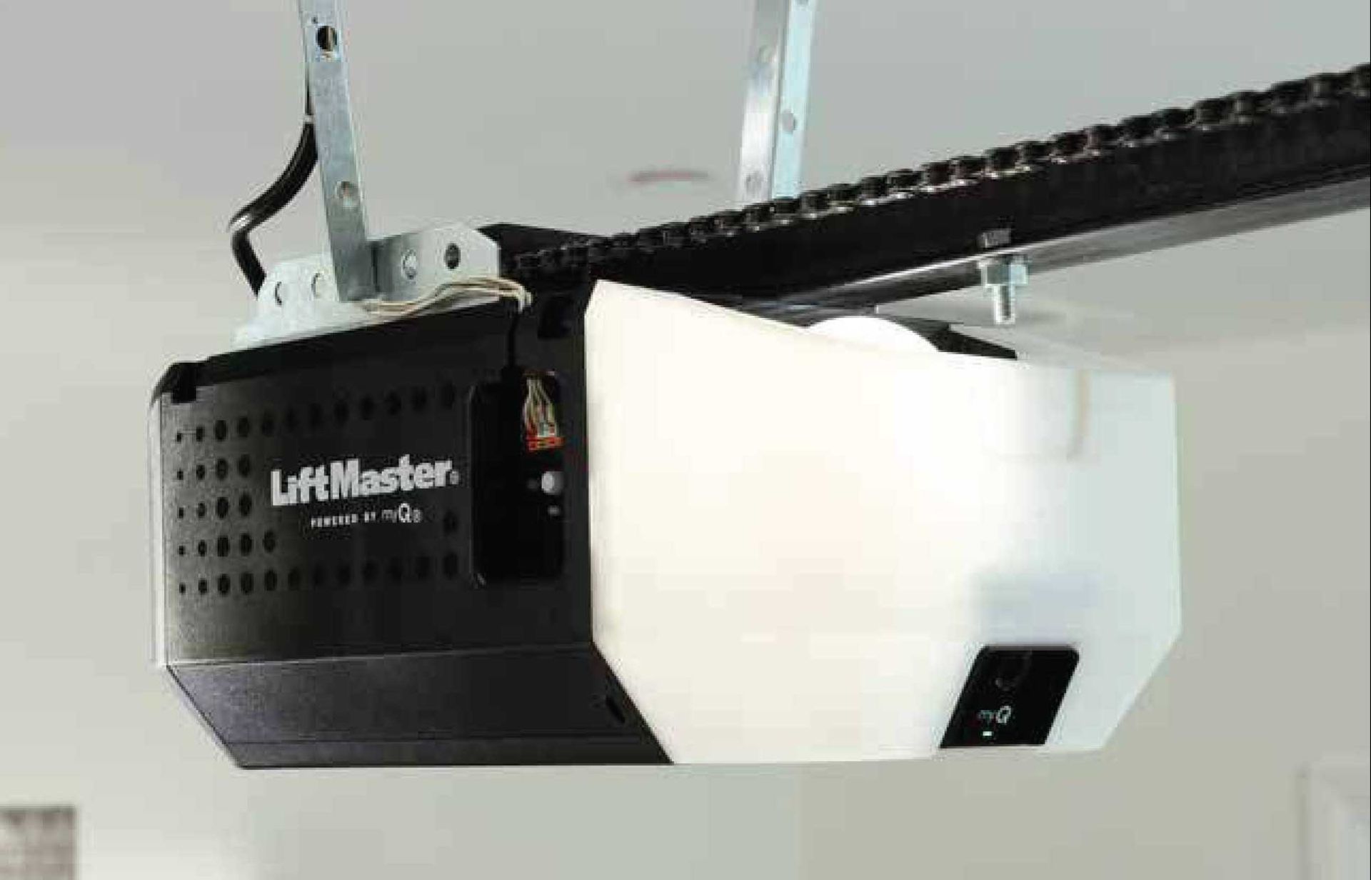 LiftMaster garage door opener with chain drive, mounted on the ceiling.