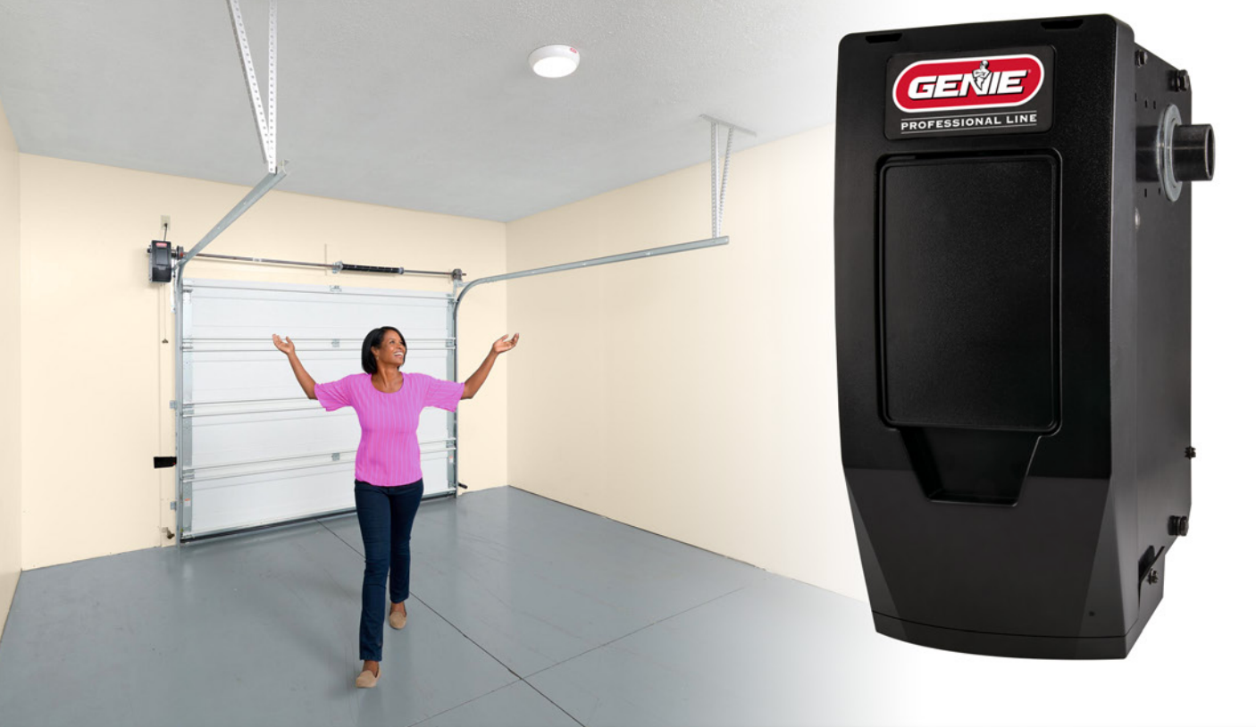 Woman standing in garage with arms up, near garage door and black garage door opener.