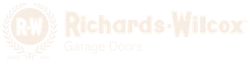 Faded Richards-Wilcox Garage Doors logo with a circular RW emblem on a light background
