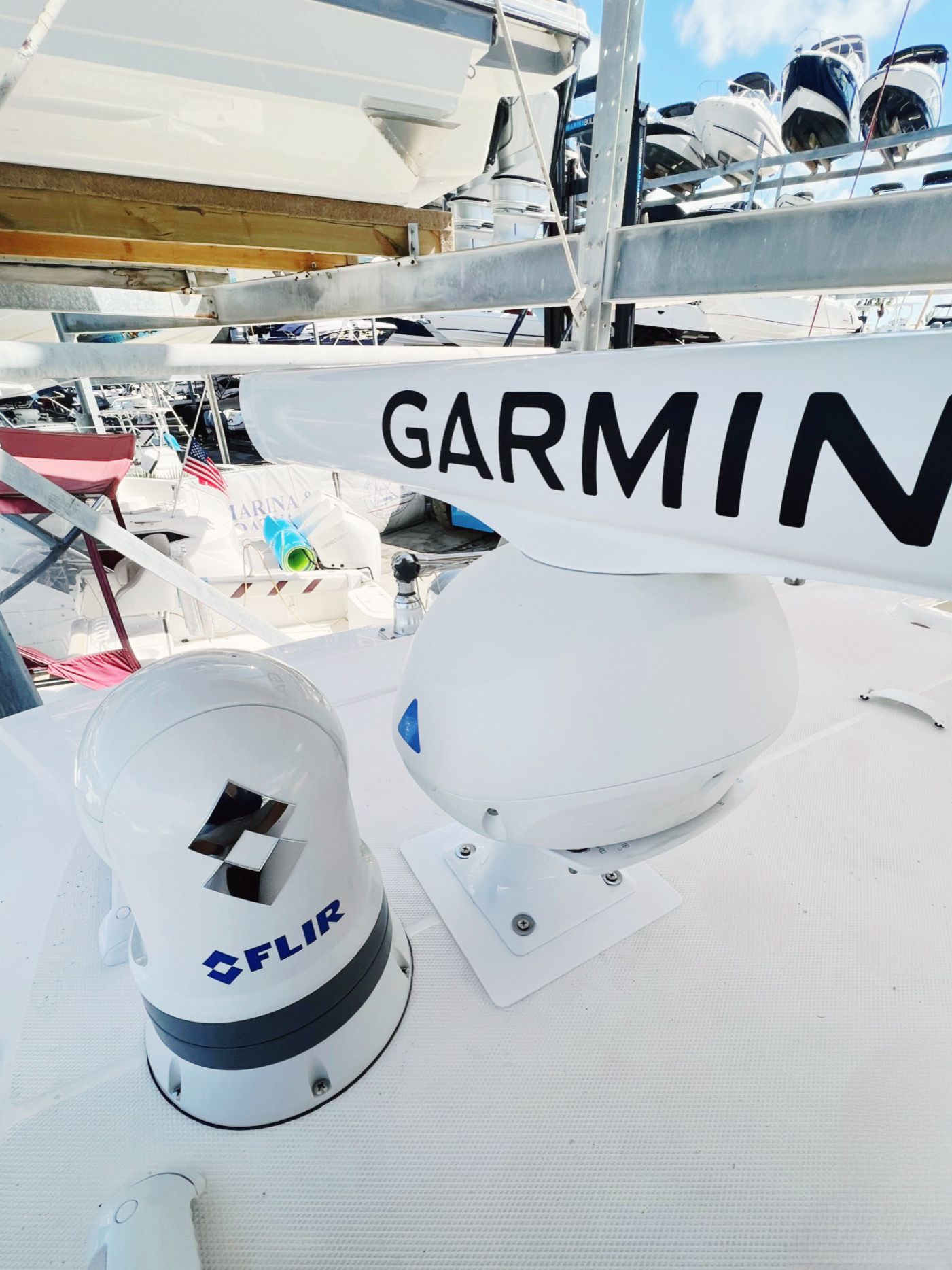 White boat deck with Garmin radar and FLIR camera.