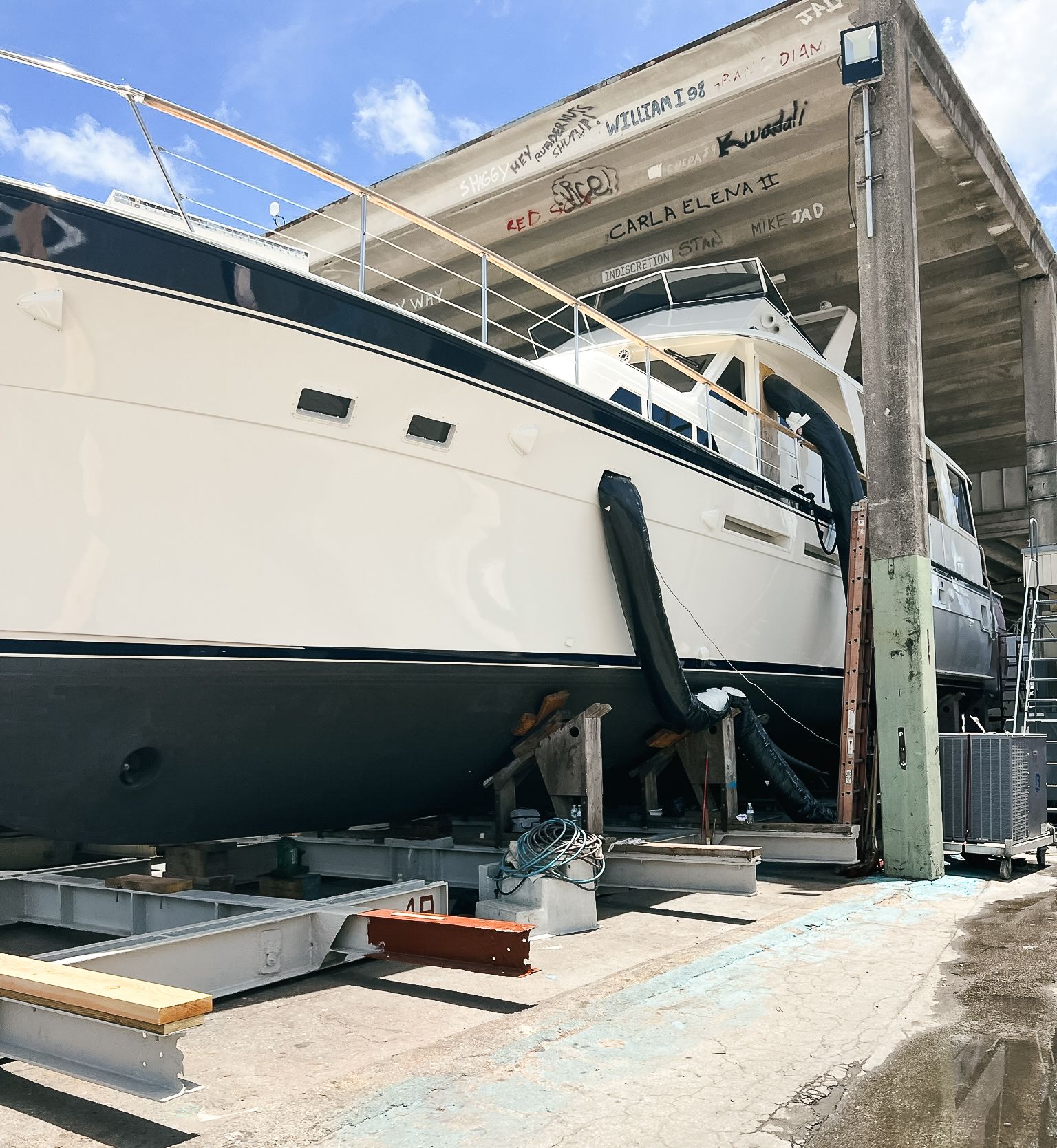 A boat is sitting in a dock under a building.
