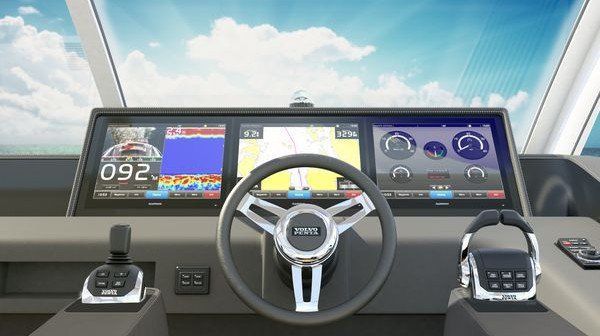 The interior of a boat with a steering wheel and dashboard.