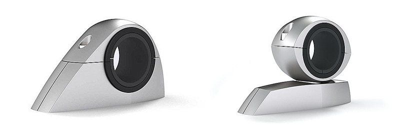 A pair of speakers sitting on top of each other on a white surface.
