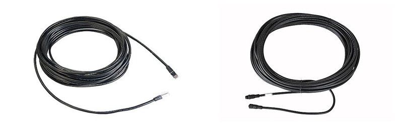 Two rolls of black wire with a white background.