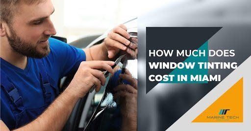 A man is tinting a car window in miami.
