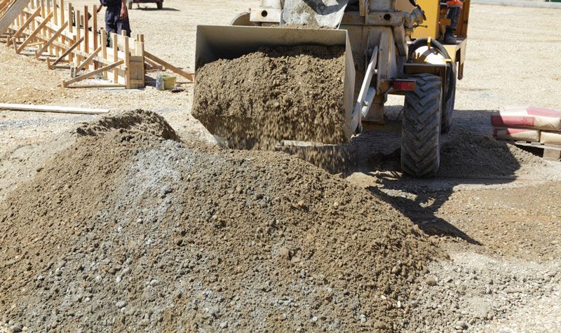 Bulldozer is Loading Road Base CBR15 Into a Pile on a Construction Site — Barry's Recycling in Brisbane, QLD