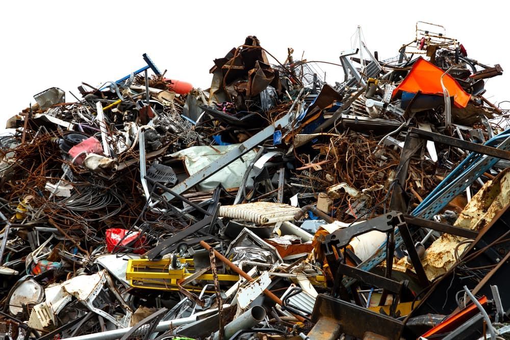 A Pile of Scrap Metal on A White Background — Greenline Recycling in Redland Bay, QLD