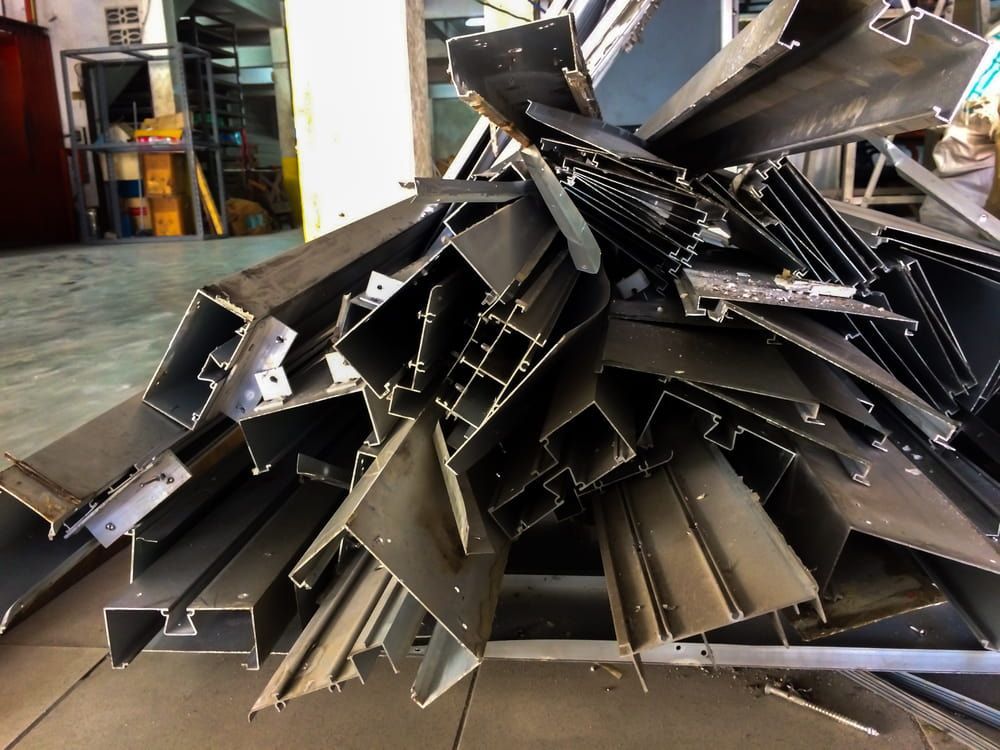 A Pile of Metal Pieces Are Stacked on Top of Each Other — Barry's Recycling in Redland Bay, QLD