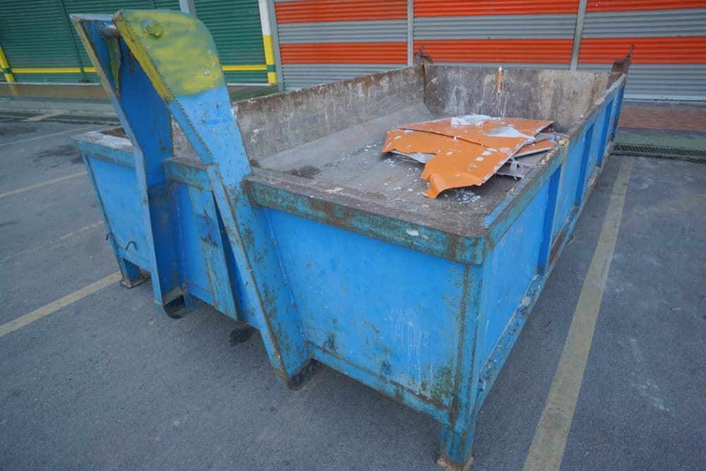 A Blue Dumpster Is Sitting in A Parking Lot — Greenline Recycling in Brisbane, QLD