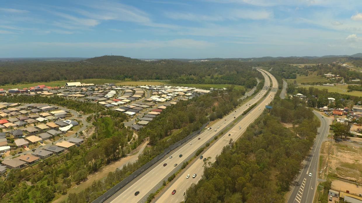 An Aerial View of a Highway Going Through a Residential Area — Barry's Recycling in Ormeau, QLD