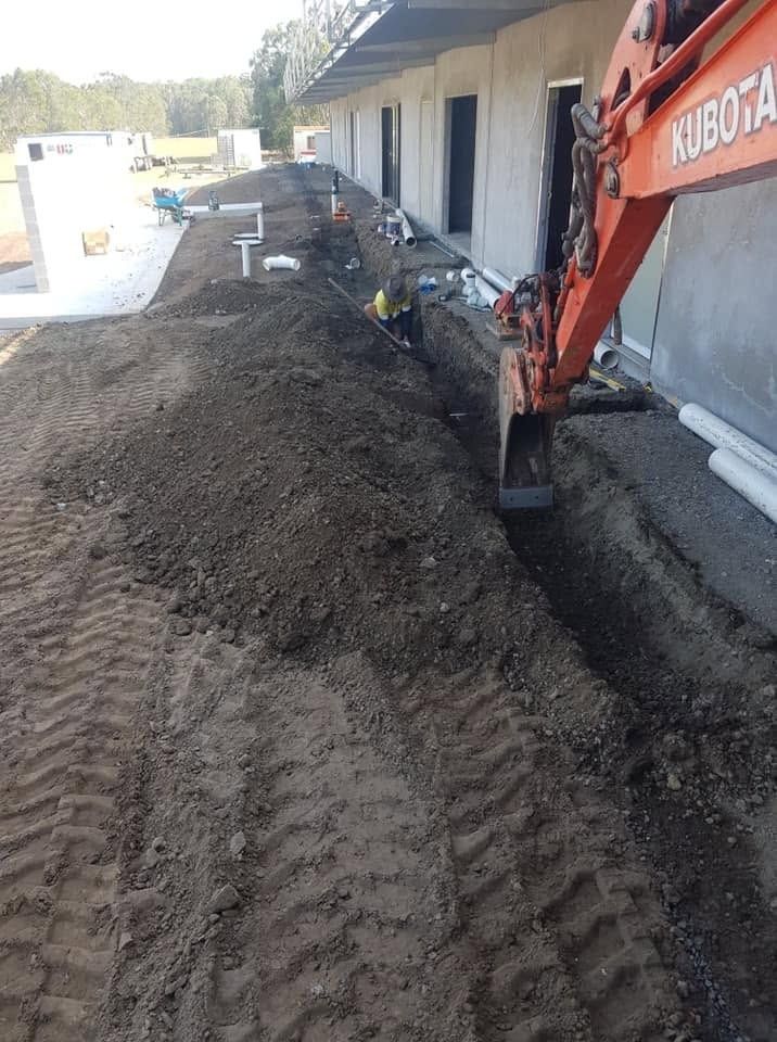 Orange Excavator Digging in Ballina
