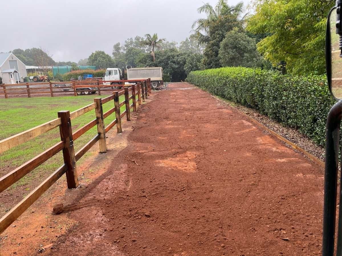 A Dirt Road With a Wooden Fence on the Side of It  — Northstar Excavations In Alstonville, NSW