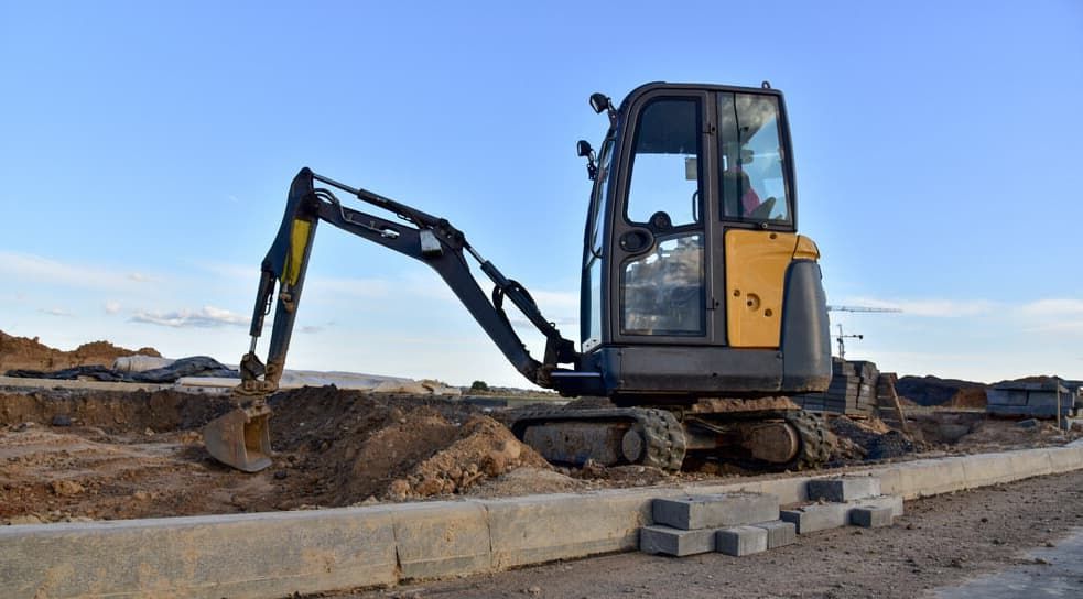 A Small Excavator Is Working On A Construction Site — Northstar Excavations In Ballina, NSW