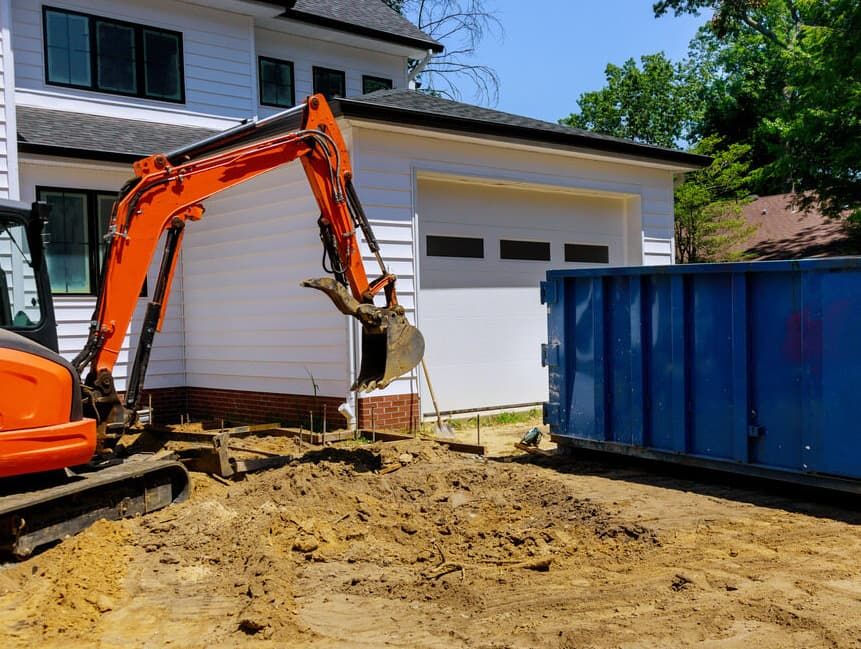 An Excavator Is Digging A Hole In Front Of A House — Northstar Excavations In Ballina, NSW