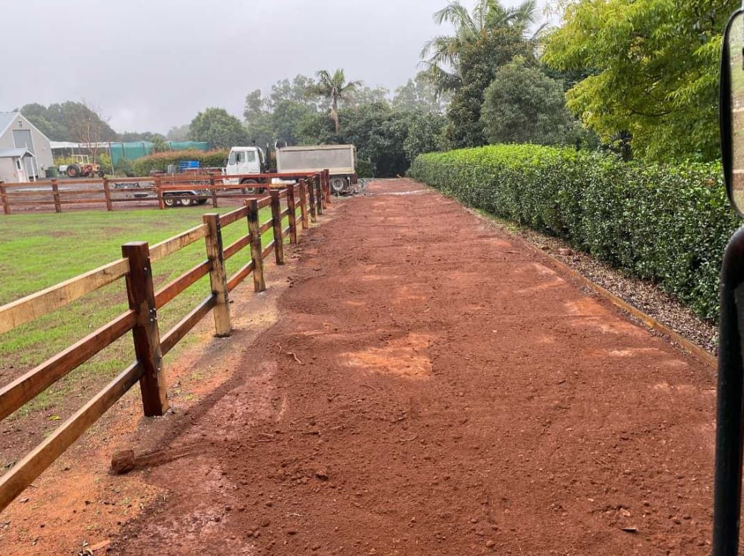 A Dirt Road With A Wooden Fence On The Side Of It — Northstar Excavations In Alstonville, NSW