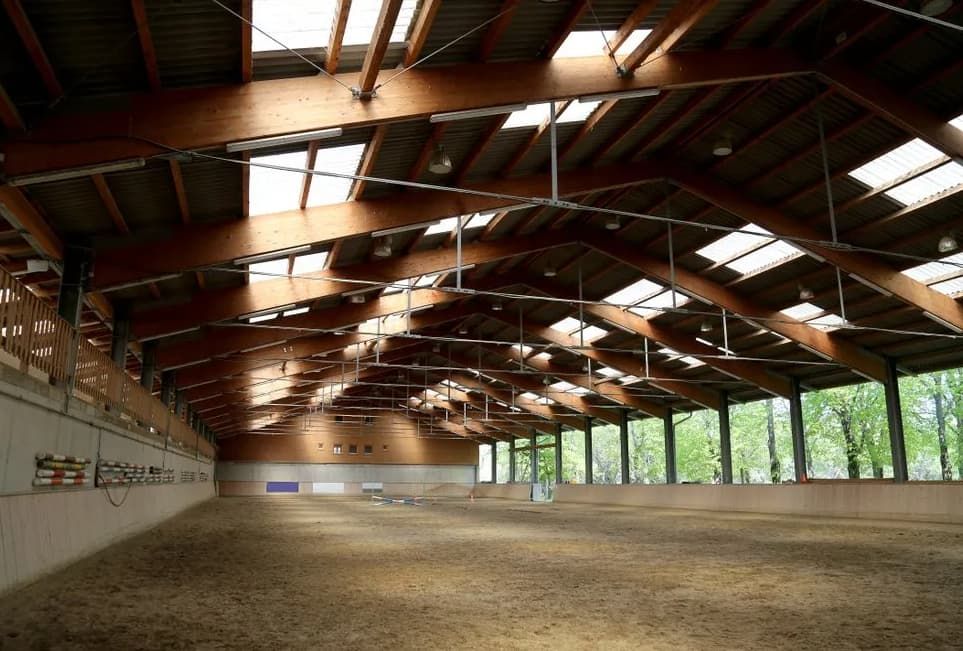 A Large Indoor Arena With A Wooden Roof And A Lot Of Windows — Northstar Excavations In Alstonville, NSW
