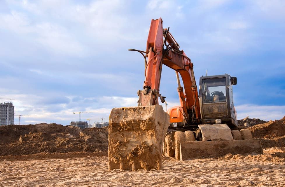 An Excavator Is Moving Dirt On A Construction Site — Northstar Excavations In Mullumbimby, NSW