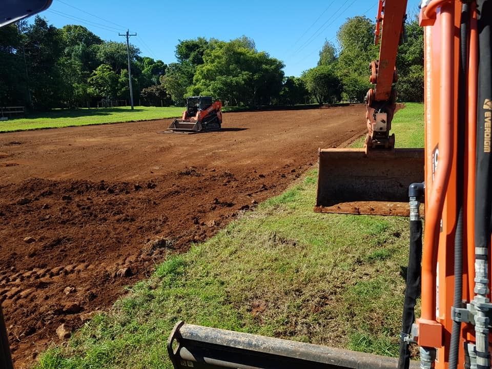 Excavator and Bulldozer Doing Earthmoving