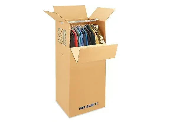Open cardboard box filled with colorful folded shirts, shipping box with open flaps