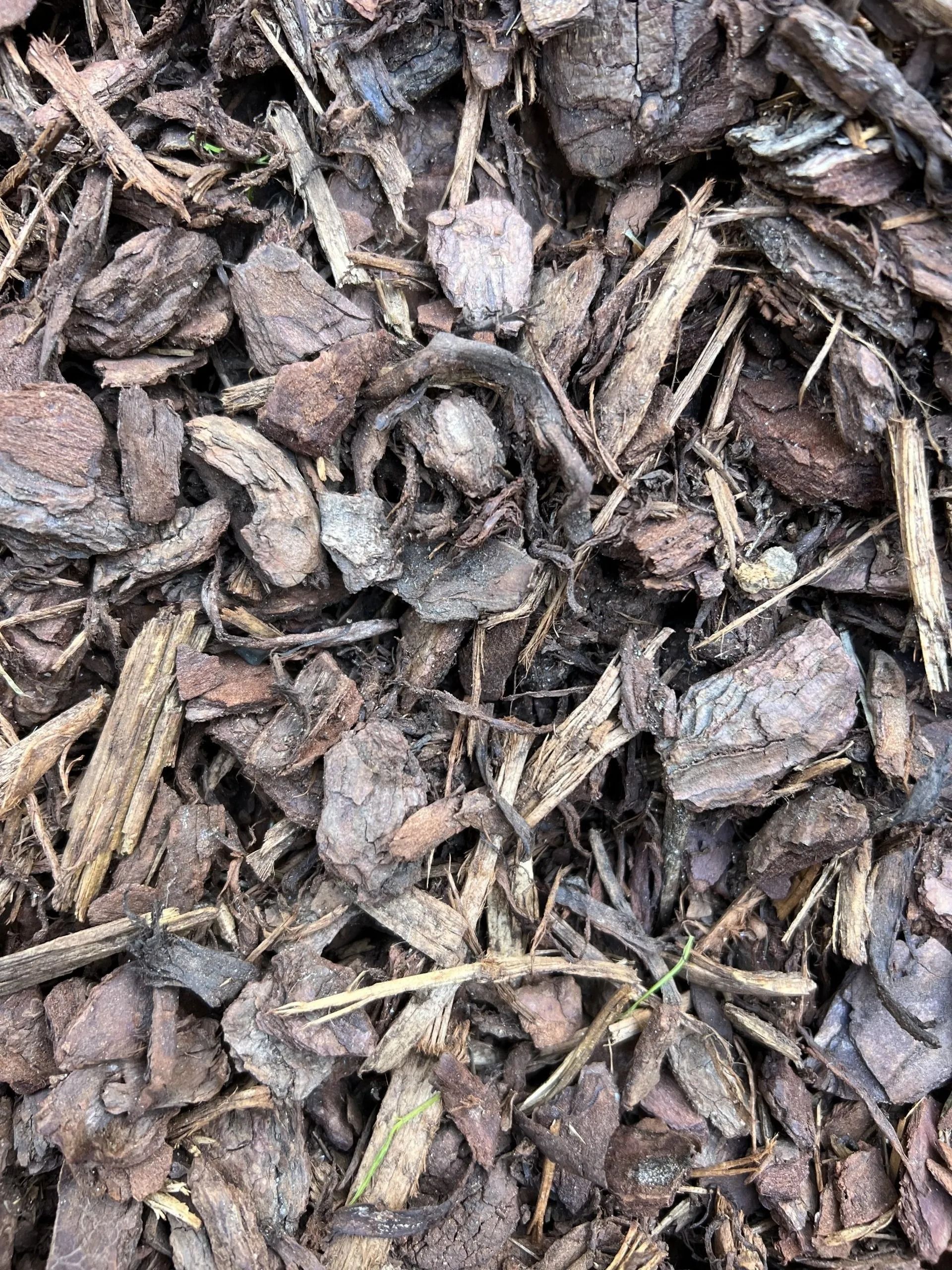 Brown Mulch Composed of Bark and Wood Chips — Hunter Valley Bricks & Pavers in Scone, NSW