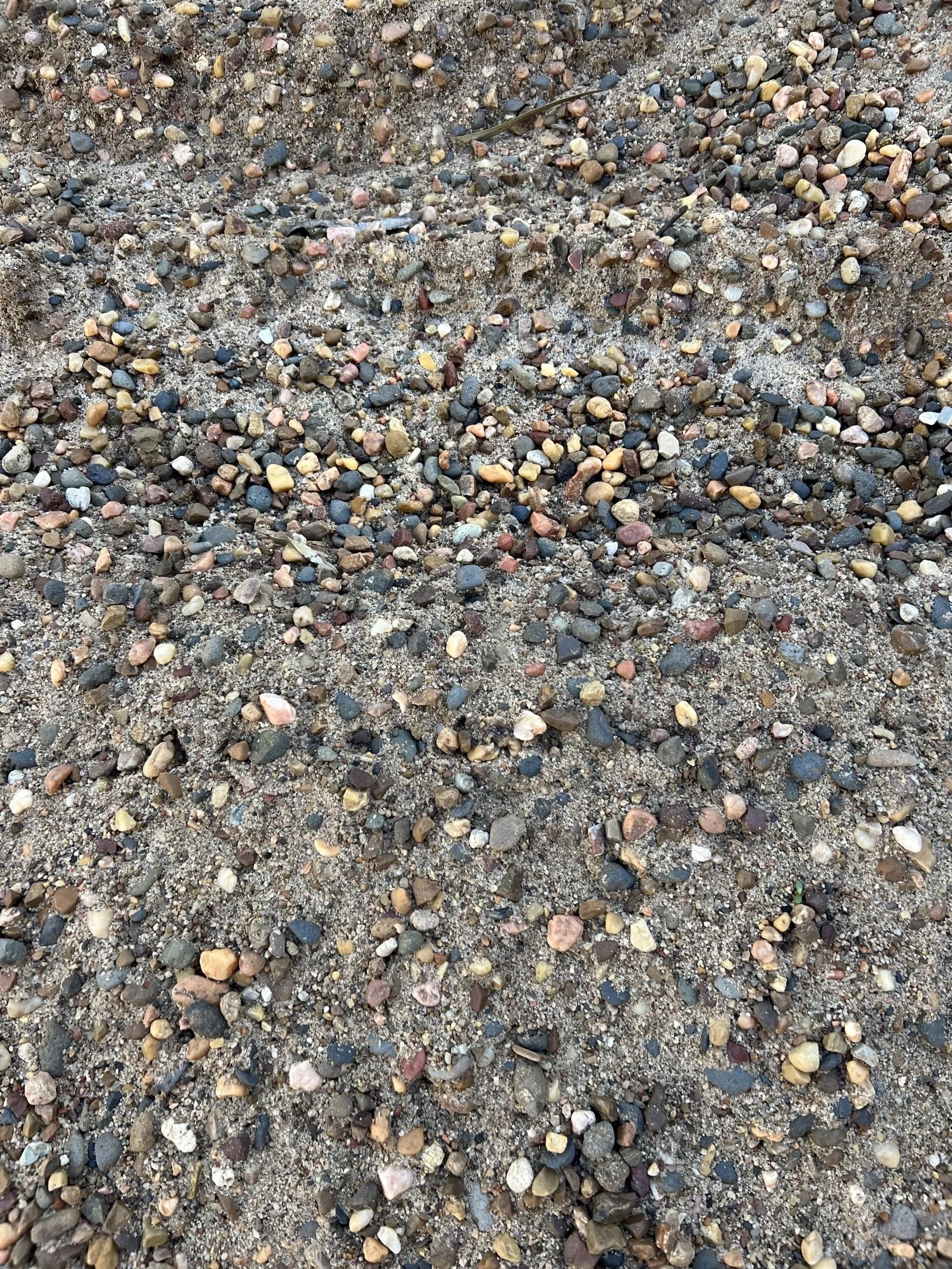 Pile of Gray Sand and Small, Mixed-colour Pebbles — Hunter Valley Bricks & Pavers in Scone, NSW