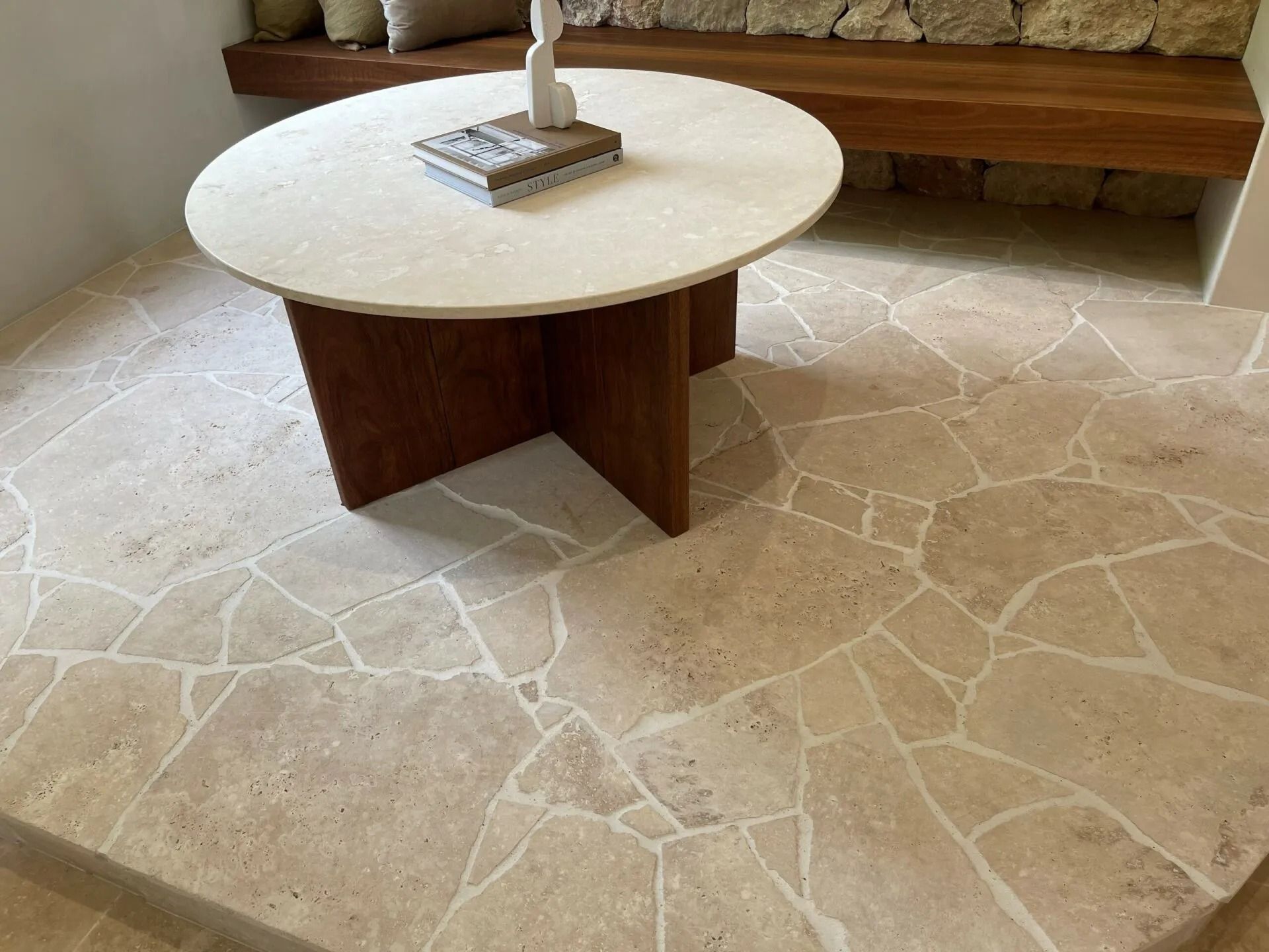Round Stone Table on Irregular Stone Tile Floor — Hunter Valley Bricks & Pavers in Scone, NSW