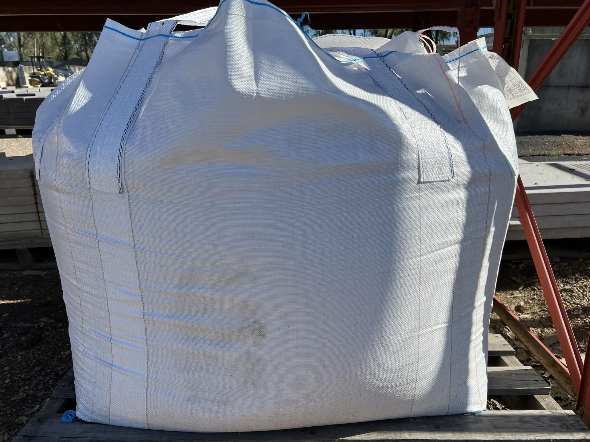 Large White Bulk Bag Filled, on a Wooden Pallet Outdoors — Hunter Valley Bricks & Pavers in Scone, NSW