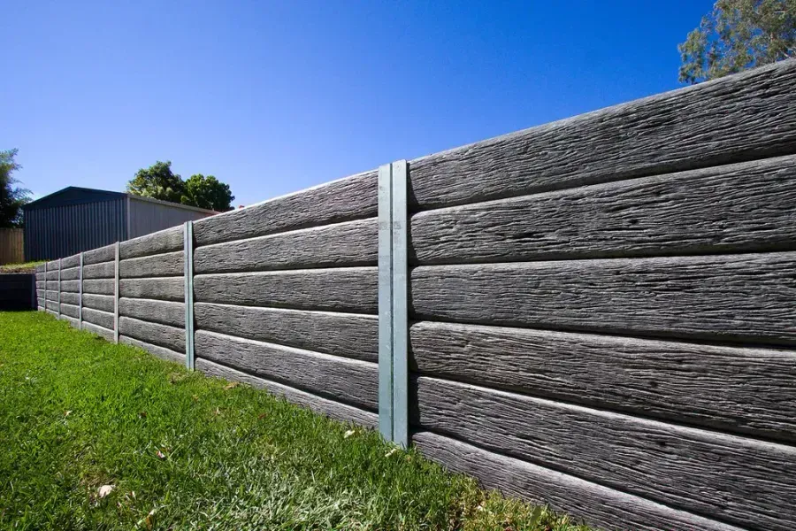 Gray Wooden Fence With Vertical Metal Supports — Hunter Valley Bricks & Pavers in Scone, NSW