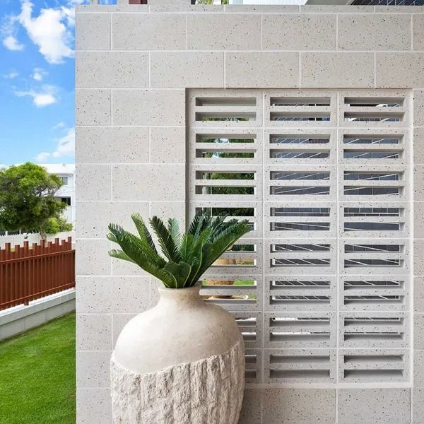 Stone Block Wall With a Rectangular Window of Horizontal Openings — Hunter Valley Bricks & Pavers in Scone, NSW