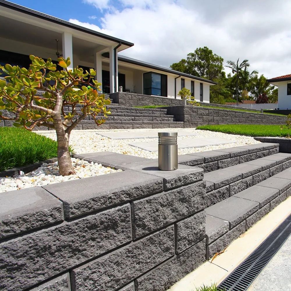 Stone Retaining Walls and Steps Leading Up to a Modern House — Hunter Valley Bricks & Pavers in Scone, NSW