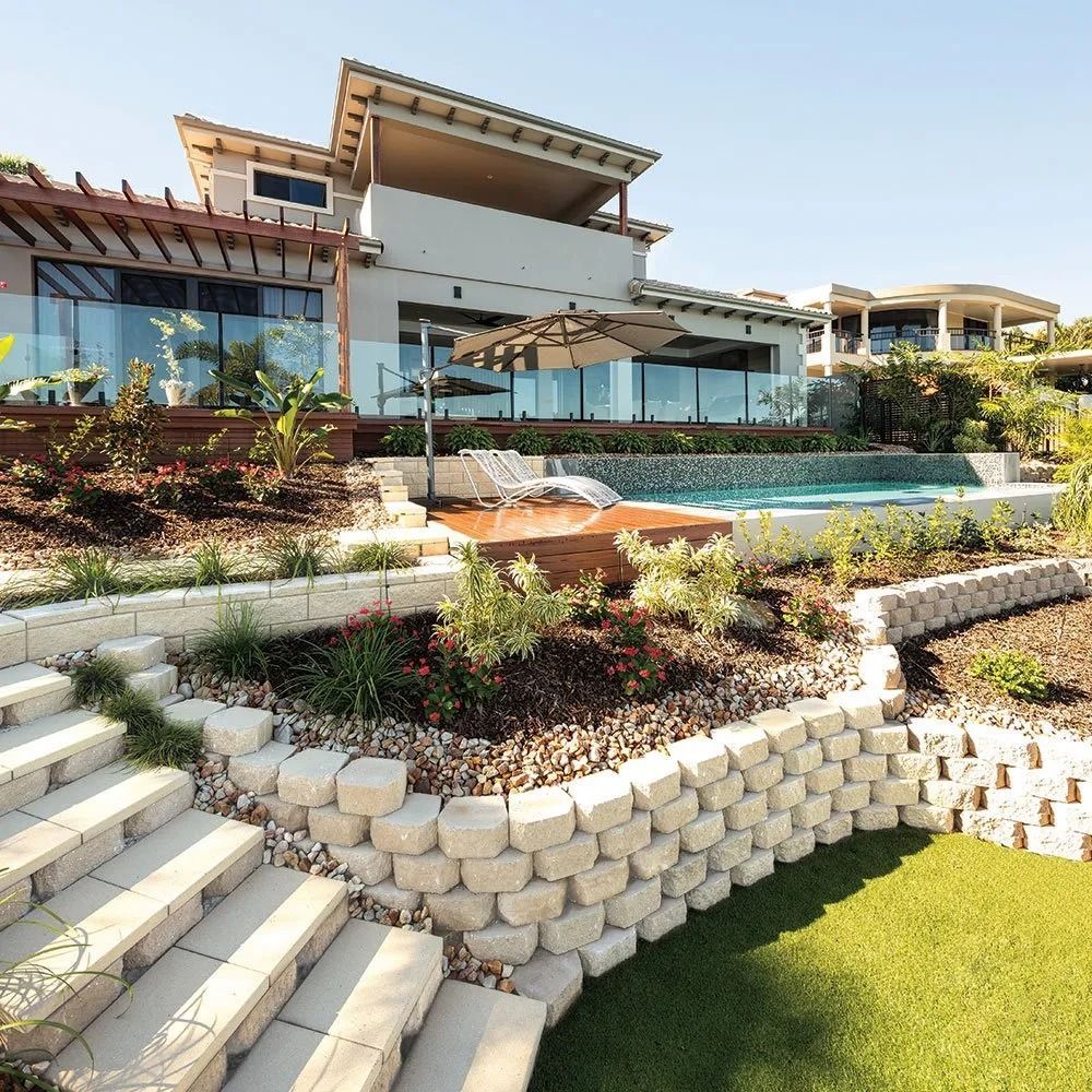 Multi-level Backyard With Retaining Walls, Stairs, Pool, and Modern House — Hunter Valley Bricks & Pavers in Scone, NSW