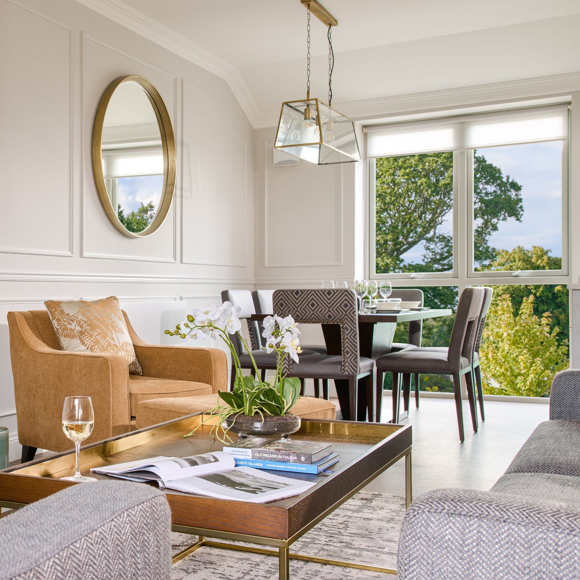 A living room with a couch a chair and a coffee table