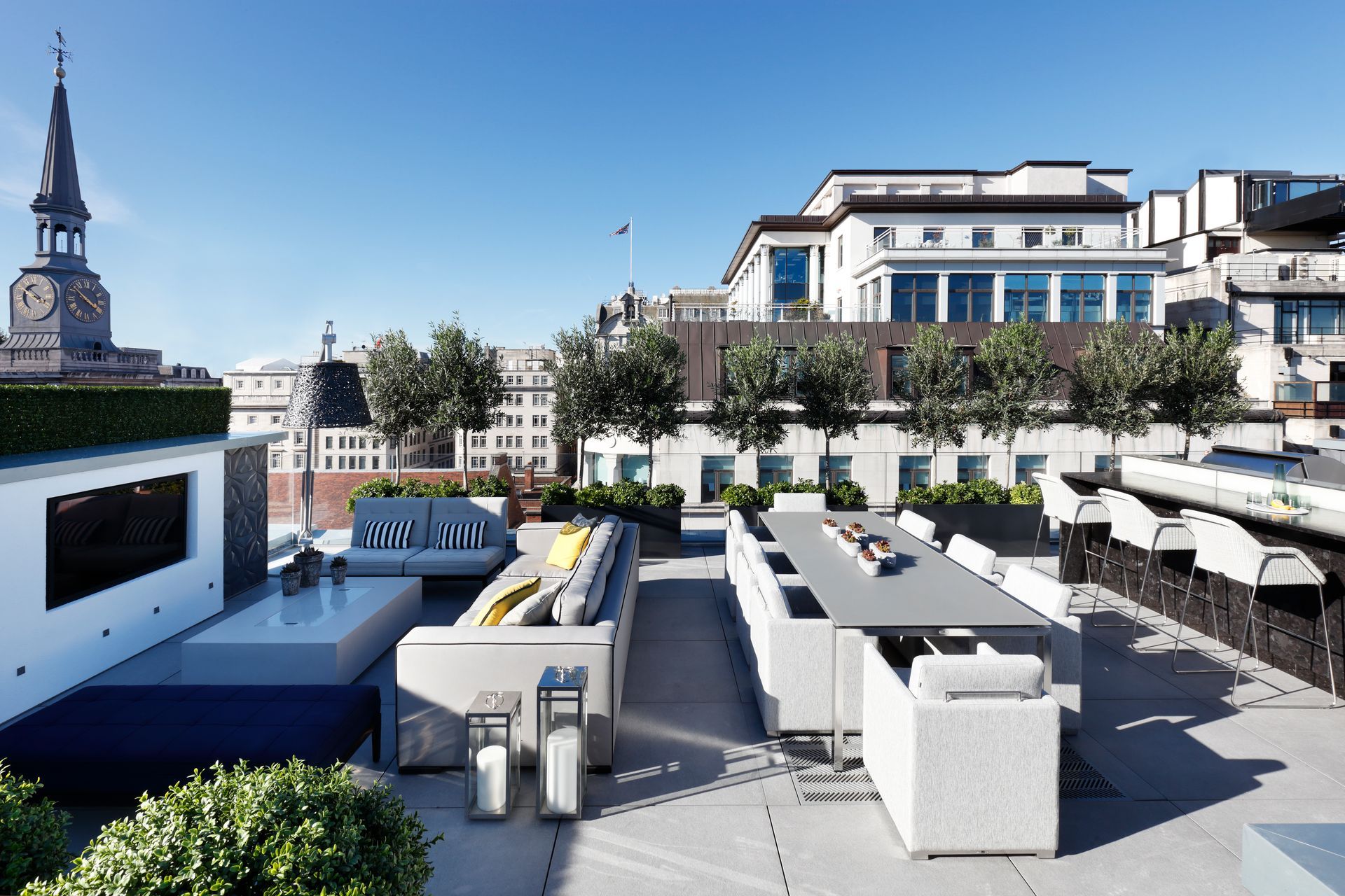 An artist 's impression of a rooftop patio with a clock tower in the background