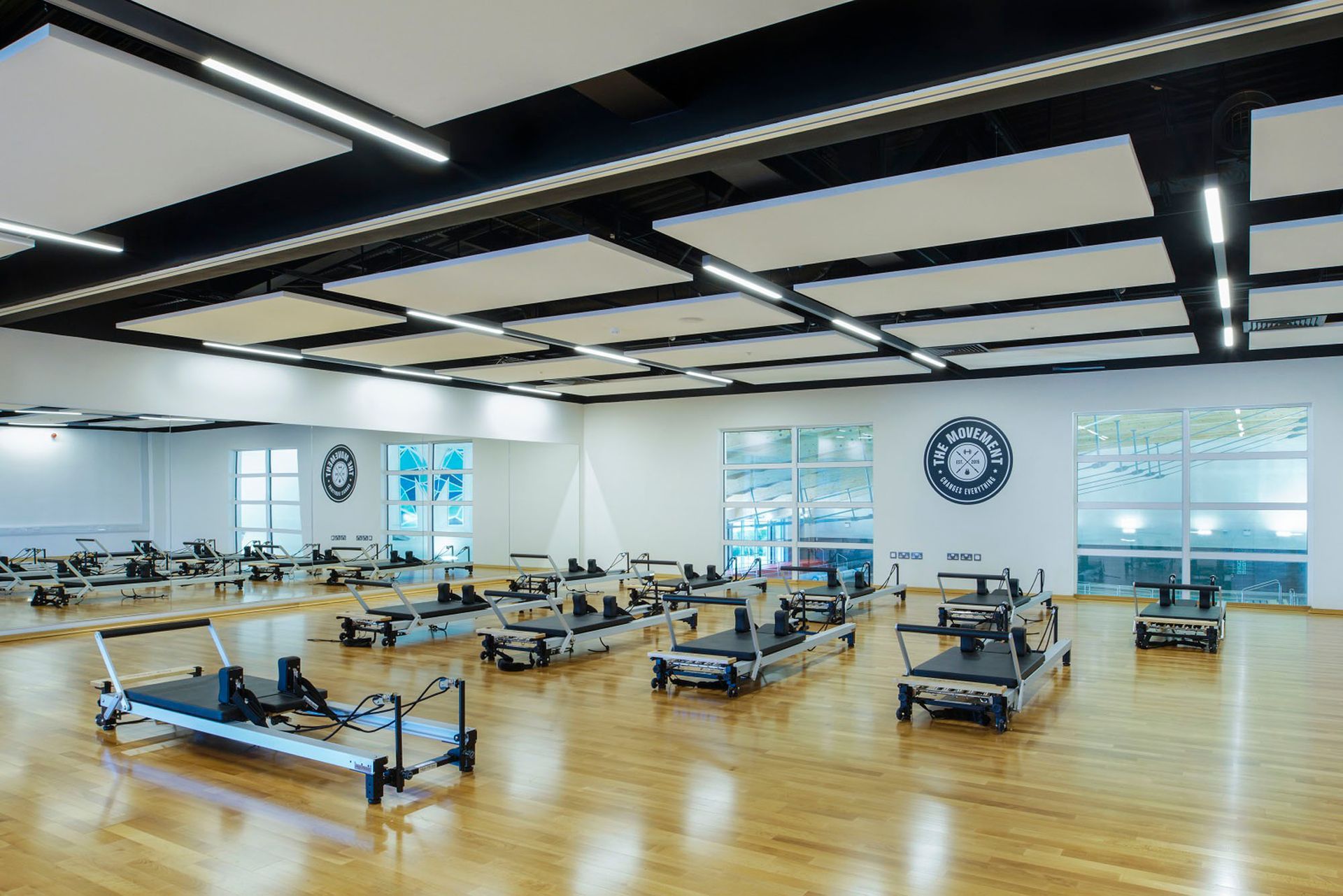 There are a lot of pilates machines in this gym.