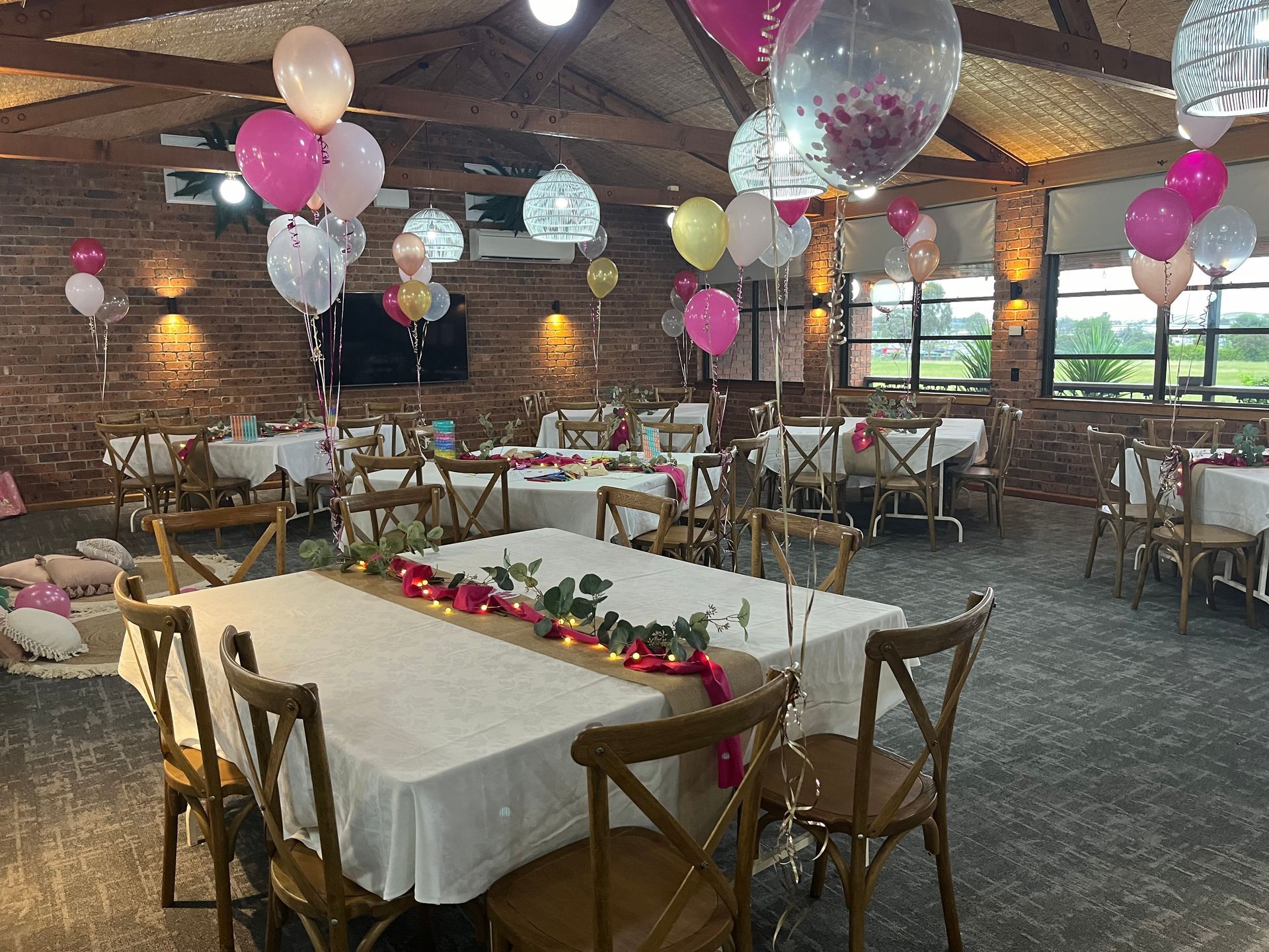 A Large Room Filled with Tables and Chairs and Balloons - Function Venue in Hillvue, NSW