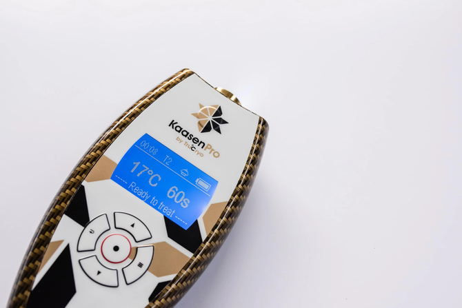 A remote control with a screen that says 17 degrees celsius