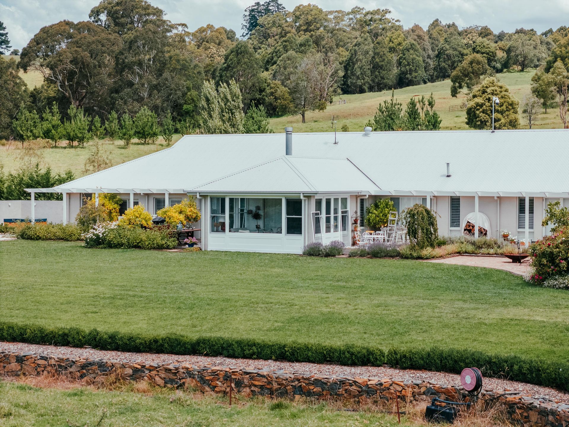 White Balcony Railing Against a Bright Blue Sky, With a Tree in the Corner — Mittagong Painting in Moss Vale, NSW