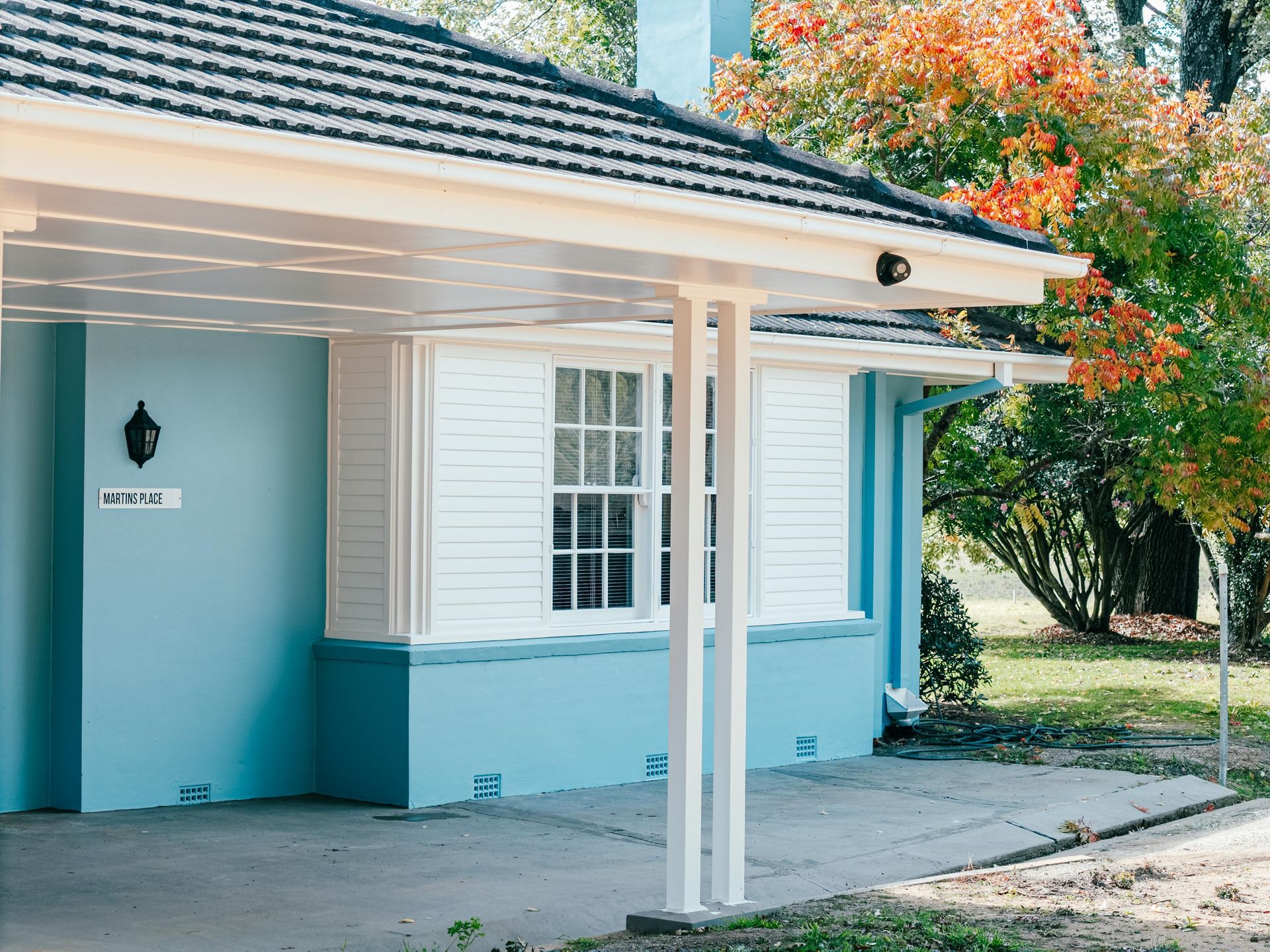Turquoise House Porch With White Columns — Mittagong Painting in Welby, NSW