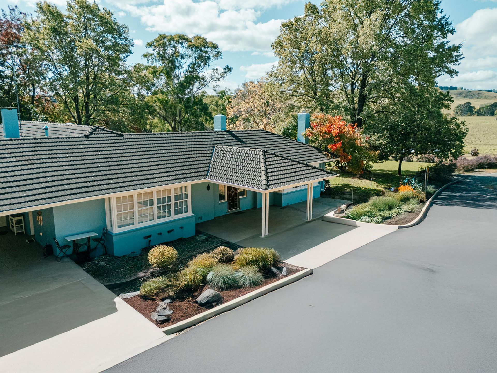 Blue Building With Shingled Roof — Mittagong Painting in Welby, NSW