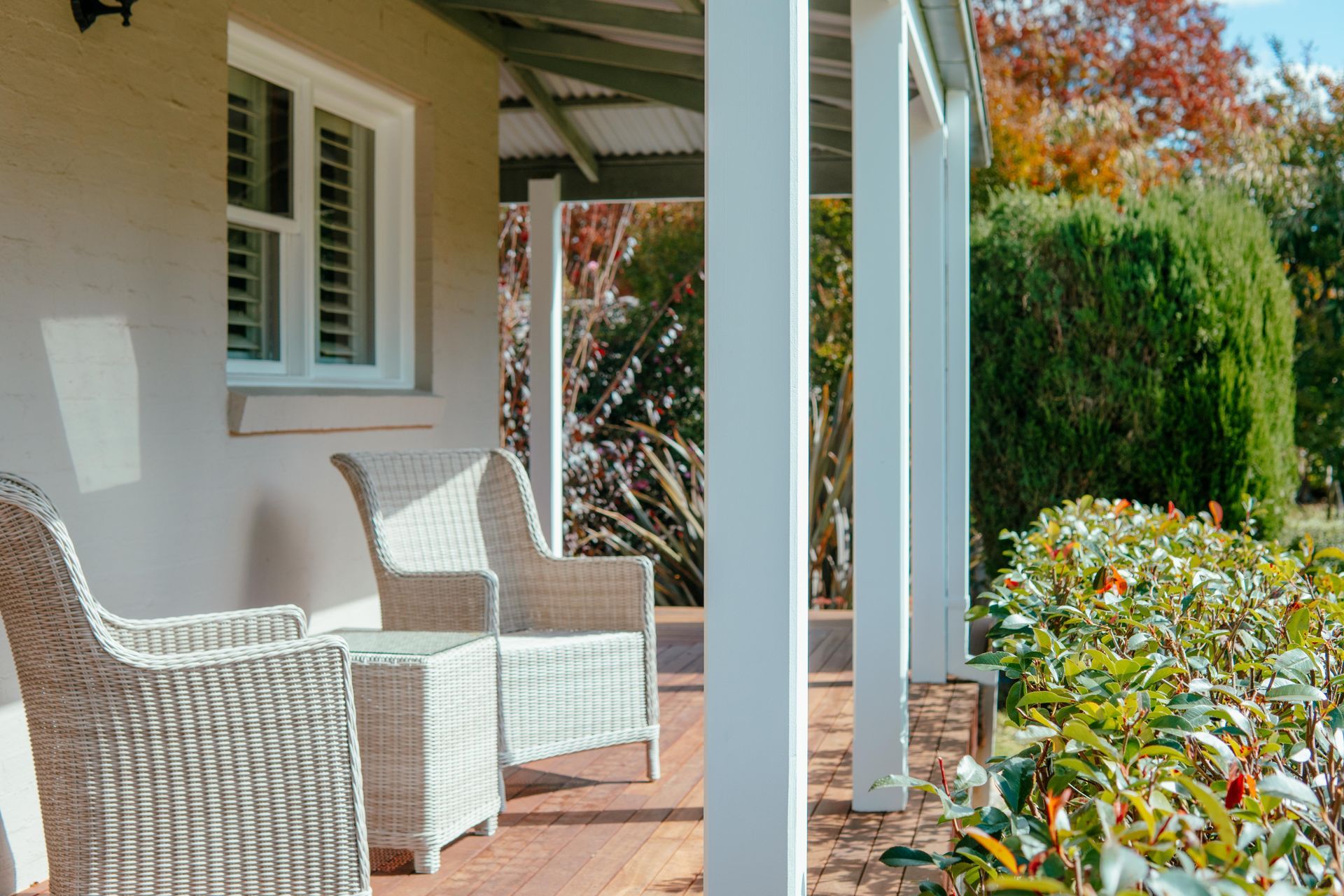 White Wicker Chairs on a Porch — Mittagong Painting in Welby, NSW