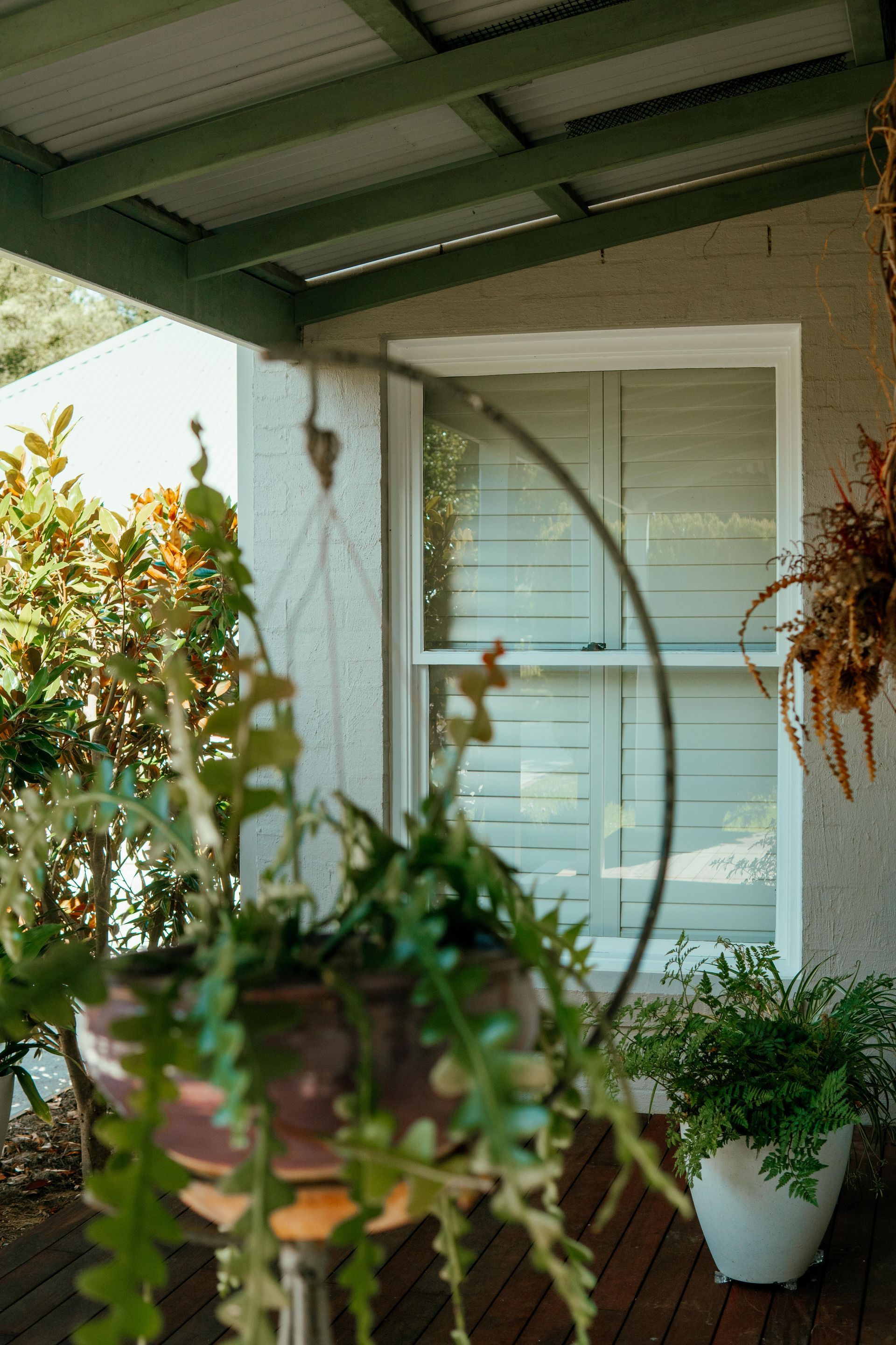 Front Porch With Hanging and Potted Plants — Mittagong Painting in Welby, NSW