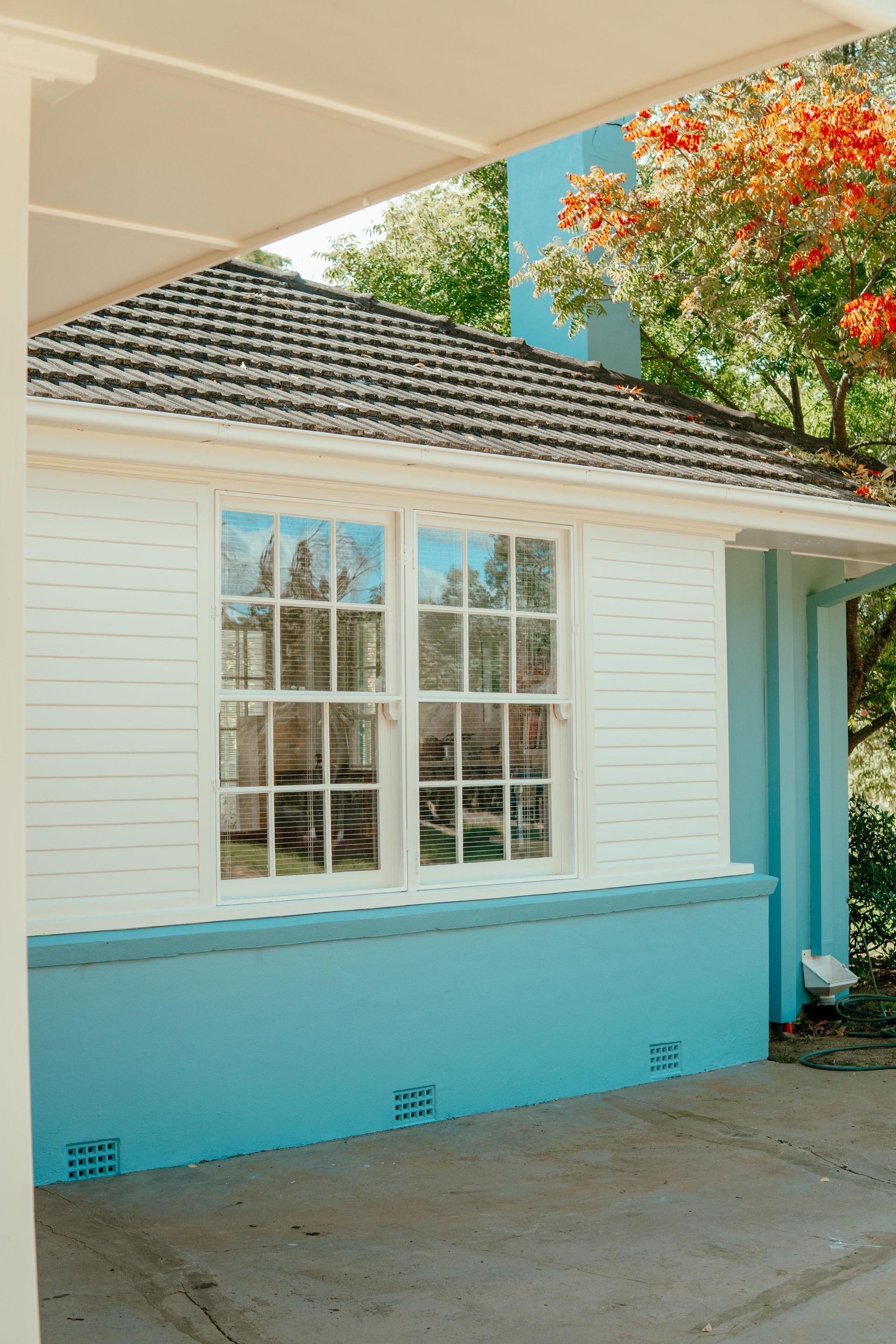 White House Exterior With Blue Lower Trim — Mittagong Painting in Welby, NSW
