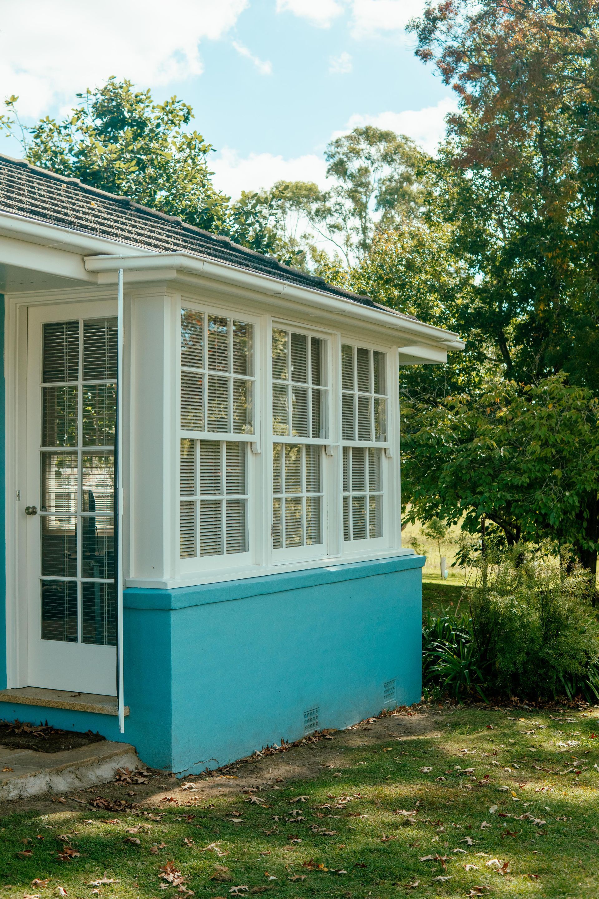 Small White House With Turquoise Lower Siding — Mittagong Painting in Welby, NSW