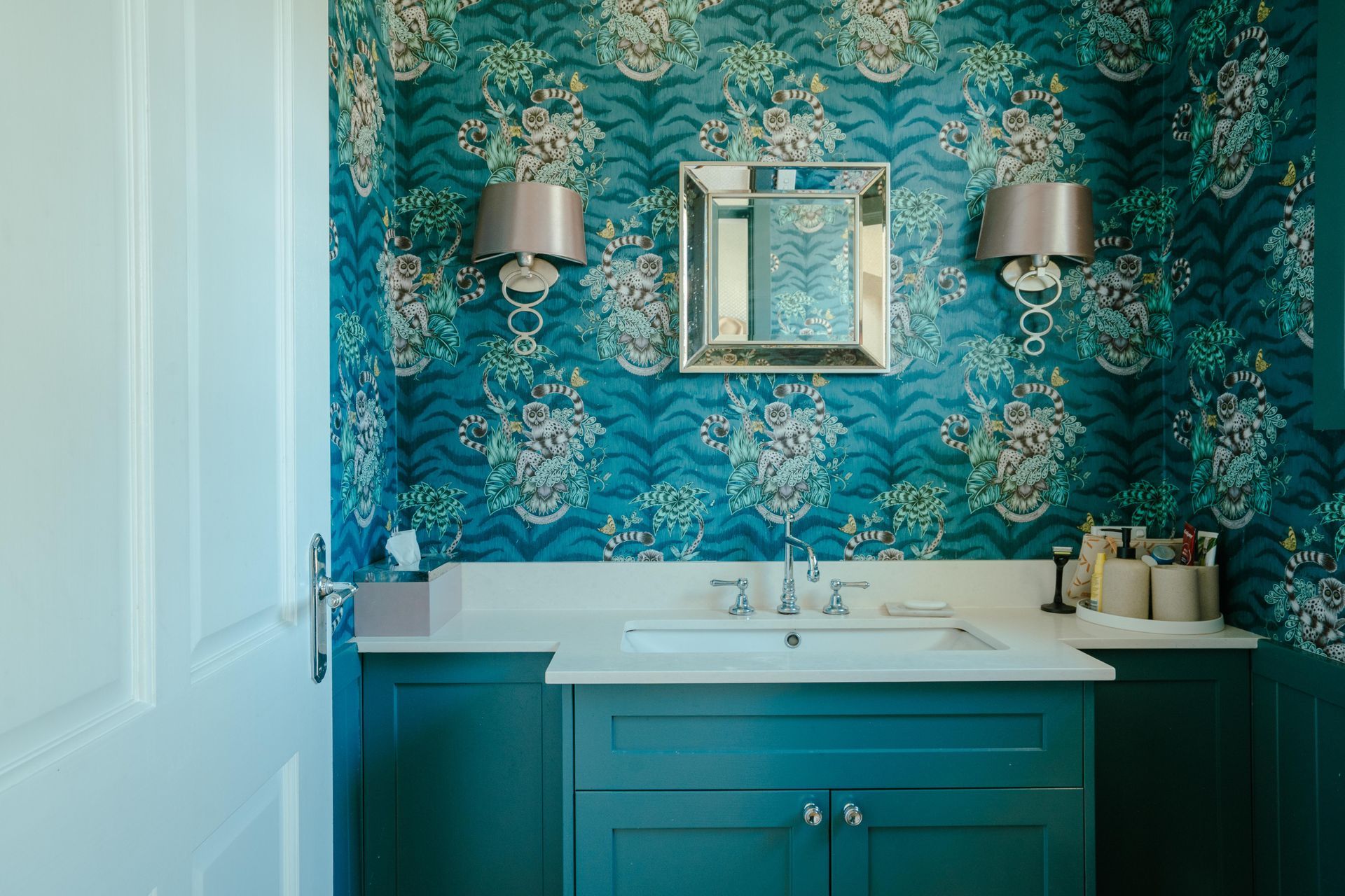 Teal Bathroom With Floral Wallpaper, Teal Cabinet, White Sink, Silver Sconces, and Mirror — Mittagong Painting in Welby, NSW