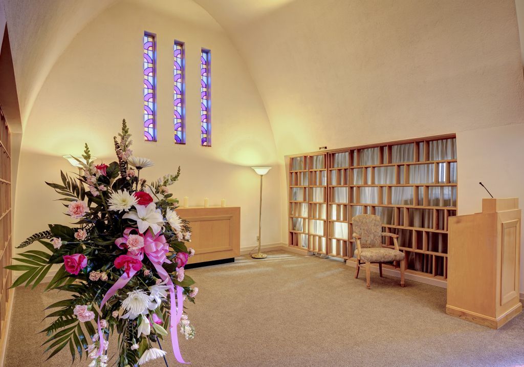 A church with a podium and a bouquet of flowers
