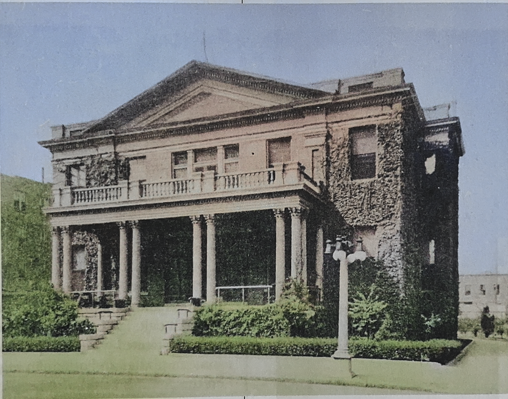 A black and white photo of a large stone building