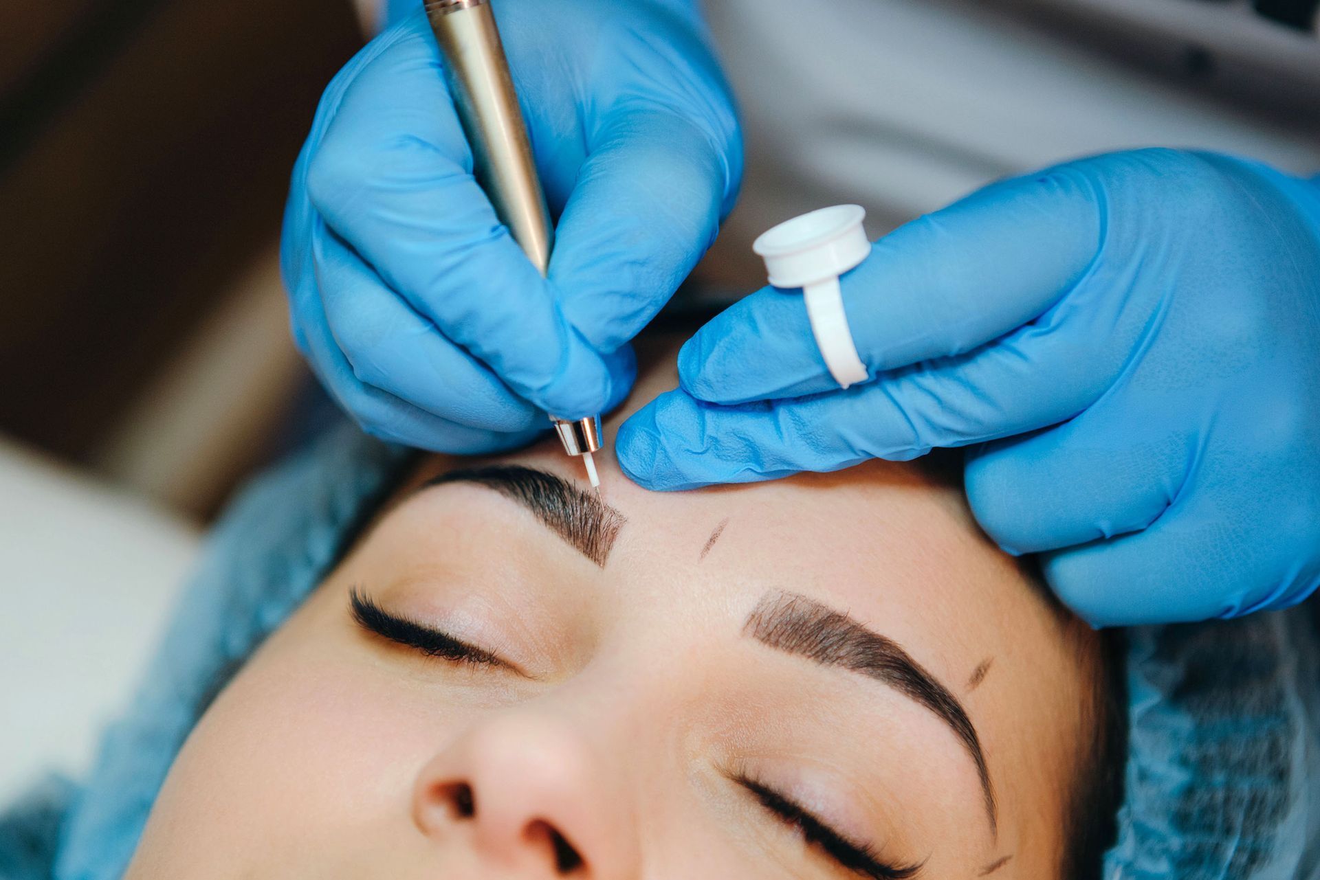 Woman undergoing nano brow procedure