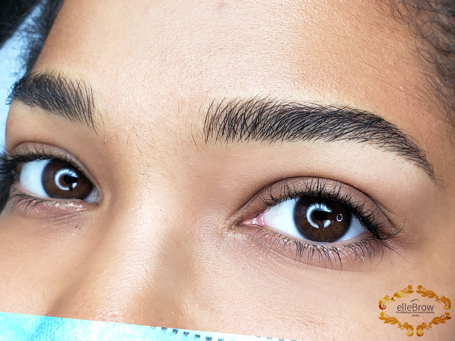 A close up of a woman 's eyes with the letter c on them