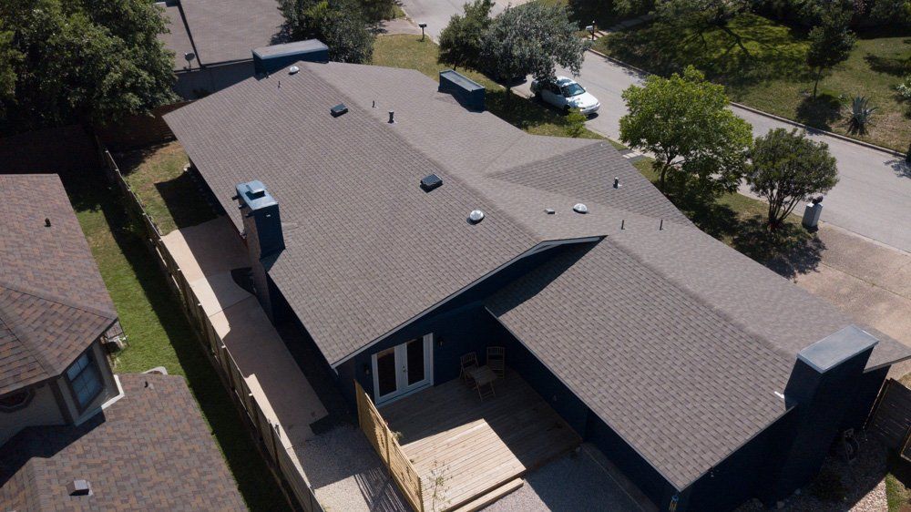 an aerial view of a house with a new roof .